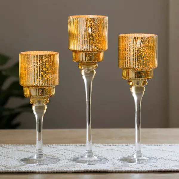 Kirklands Gold Optic Glass Stemmed Hurricanes, Set of 3 Kirklands Gold Optic Glass Stemmed Hurricanes, Set of 3 - Image 1